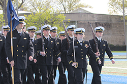 Soldiers marching on a field. Links to Gifts That Protect Your Assets
