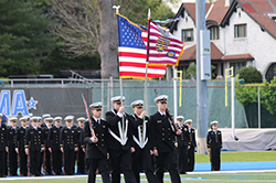 Soldiers holding flags. Links to Gifts from Retirement Plans
