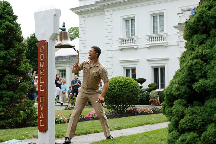 A man ringing a bell